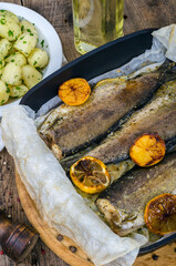 Baked appetizing trout and pepper mill