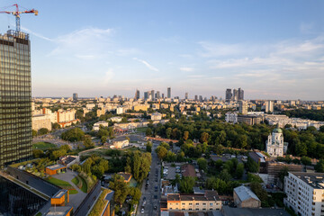 Obraz premium Warsaw during the day. Busy city seen from above on a beautiful sunny day. The largest city in Poland, shown in a wonderful way.
