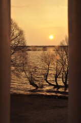 Sunrise in Novgorod , Russia . Juriev Monastery . View on Rurikovo gorodishe ( Rurik's Hillfort ). The flood in November