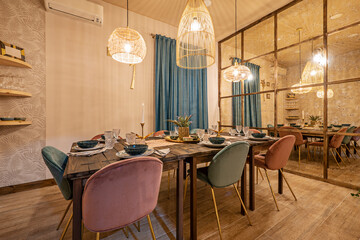 Served wooden plank dining table for six with a mirrored wall in a vacation rental apartment