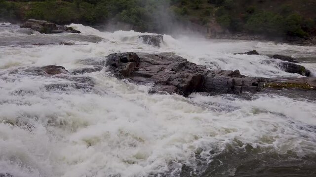 Indian River Cauvery  waters gushing through the ravines before cascading down the Gaganachukki waterfall during monsoon at Shivanasamudra in Karnataka,