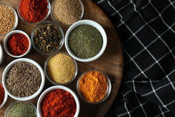 Bowls with different aromatic spices, top view
