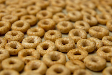closeup cheerios oat cereal in large pile, background, delicious breakfast