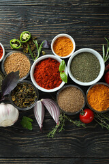 Concept of aromatic spices on rustic wooden table