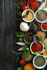 Concept of aromatic spices on rustic wooden table