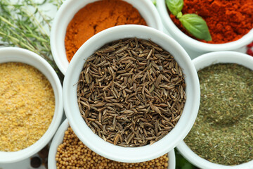 Bowls with different aromatic spices, close up