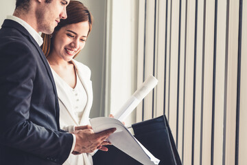 Businessman executive is in meeting discussion with businesswoman or client in modern workplace...