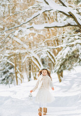 Fototapeta na wymiar Amazing little girl holding Christmas lantern outdoors on beautiful winter sunny day