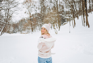 Close up portrait of an beautiful girl in a woolen sweater enjoying winter moments. Outdoors photo...