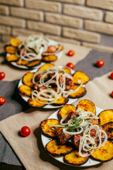 fried eggplant with onions cooked on the grill