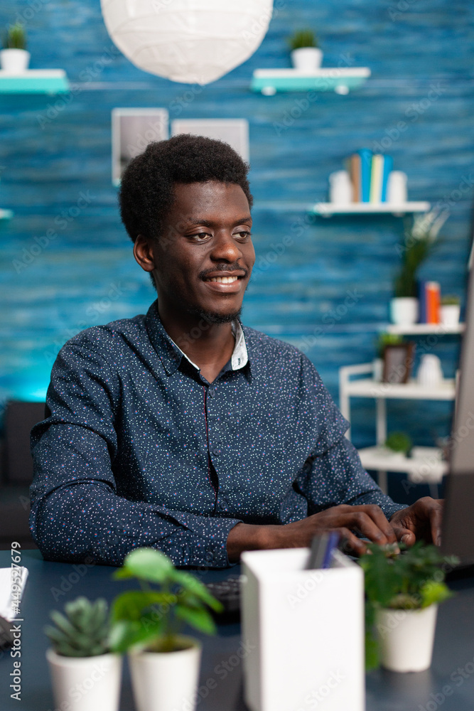 Poster black man computer user working from home at cozy desk, remote african american worker typing on com