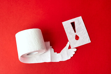 Roll of toilet paper with hand holding sheet with bloody exclamation mark - obrazy, fototapety, plakaty