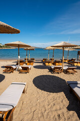 straw umbrellas on the beach at at Puta Zeza beach in Athens in Greece