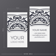 Vector Business cards of white color with vintage black ornament. Design of a business card with mandala patterns.