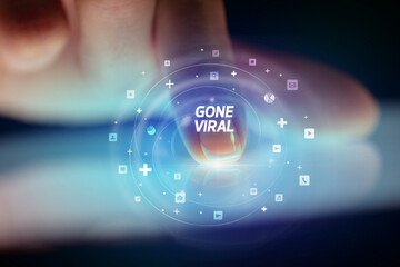 Finger touching tablet with social media icons concept