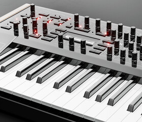 Music instriument, Synthesizer, electronic keyboard on the floor in a dark studio, 3d rendering