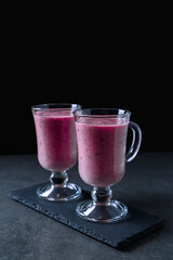 Banana-blackberry smoothie made from frozen fruits.