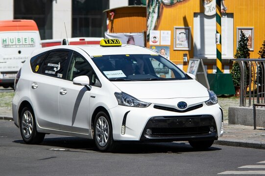 White Toyota Prius Plus Hybrid Taxi Car Waiting For A Customer In Vienna, Austria