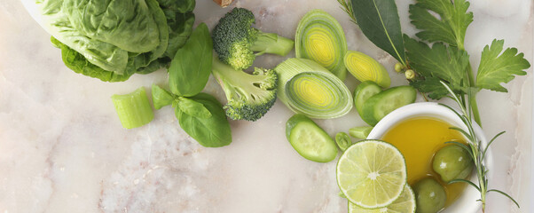 Fresh green vegetables on marble top
