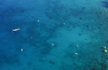 Boats from air. Aerial view on sea in Turkey. Summer seascape with clear water in sunny day. Summer seascape from air.