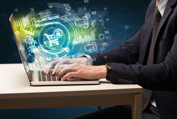 Business hand typing on a modern laptop