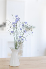 A bouquet of flax is not a white background. Scandinavian interior.