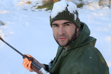 Hunter shooting in the snow