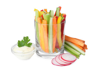 Different vegetables cut in sticks and bowl with dip sauce on white background