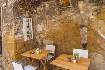 Outdoor tables in the old town of Naples, Italy