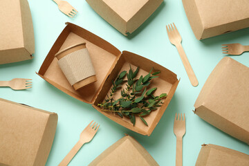Disposable eco friendly products on light blue background, flat lay