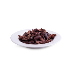 Cacao nibs are a piece of broken cocoa beans in white bowl isolated on white background