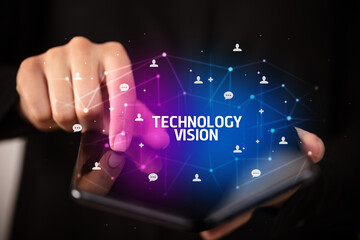 Businessman holding a foldable smartphone, new technology concept