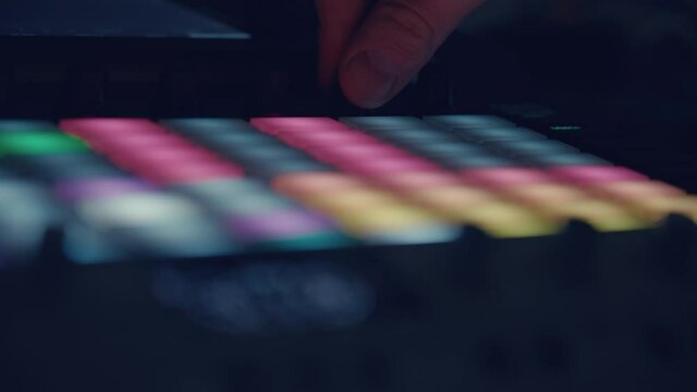 musician playing Synthesizer sequencers
Close-up of a synthesizer pad, showing a grid with a running timeline. The musician plays the pads and changes the notes of the grid sequencer