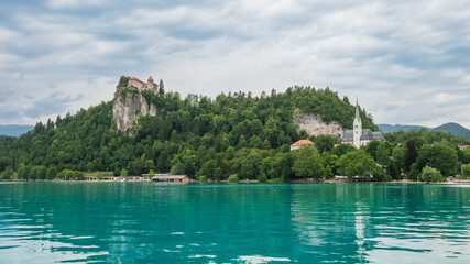 Fototapeta na wymiar Amazing view of Bled Castle in Slovenia. July clouds.