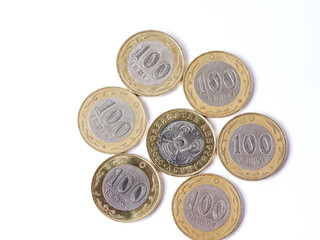 tenge coins. 100 tenge coins. flat lay