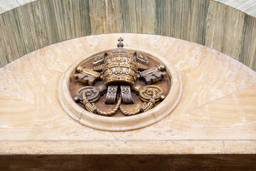 Papal emblem on wall
