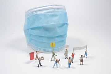 a mini figure anti-mask and anti-lockdown protesters stage