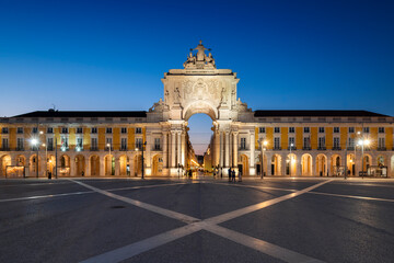 Lisbon, Portugal - July 16, 2021: View of the Commerce Square (Praca do Comercio) and the Rua Augusta triumphal arch, in the city of Lisbon, Portugal, at dusk.