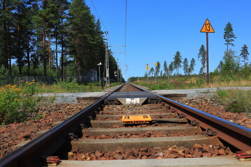 Railroad tack a sunny summer day. Long distance view at railroads for trains. Low angle outside. No...