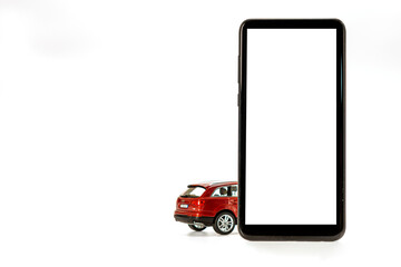 red toy car and smartphone isolated on white, concept of online carsharing, rent, buy, navigatin