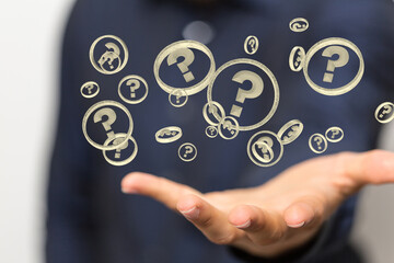 Businessman solving problem with digital question marks 3D rendering
