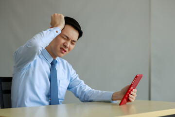 businessman headache during video call in office at work