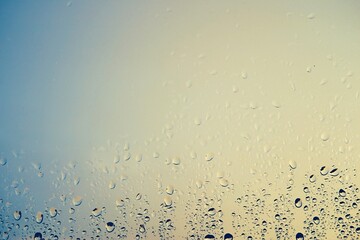 transparent glass window with raindrops