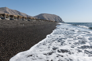 empty Black Sand beach in Santorini Greece early morning 