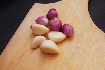 Garlic and onion with wooden background from several angle.