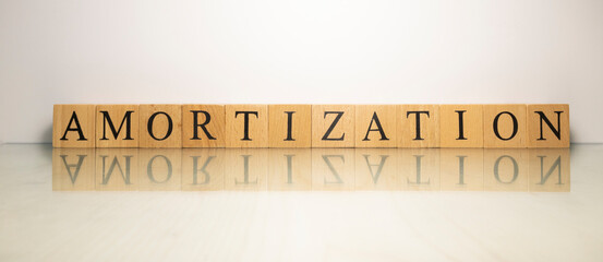 The name Amortization was created from wooden letter cubes. finance and economy.