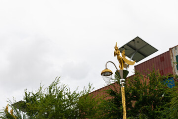 golden Kinnaree light bulb and solar energy