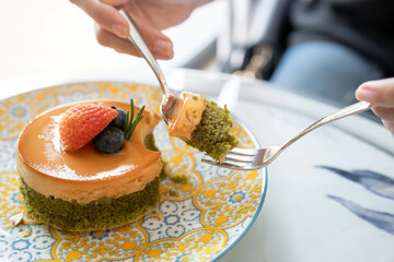 Strawberry and bruberry pudding cake in a vintage style plate.
