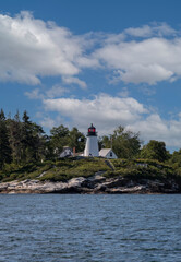 Burnt Island Lighthouse near Boothbay Harbor Maine on a sunny summer afternoon
