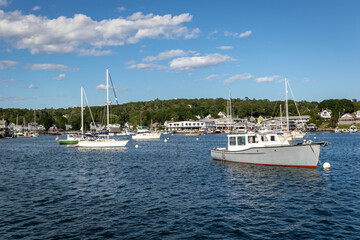 Boats and Lobster docks in Boothbay Harbor Maine on a sunny summer day